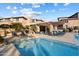 Inviting community pool with lounge chairs, pergola, and desert landscaping at 19777 N 76Th N St # 2243, Scottsdale, AZ 85255