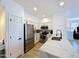 A modern kitchen with stainless steel appliances, white cabinets, and a white countertop at 19777 N 76Th N St # 2243, Scottsdale, AZ 85255