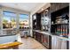 Clubhouse kitchenette features modern appliances, granite countertops, and a breakfast bar at 19777 N 76Th N St # 2243, Scottsdale, AZ 85255