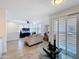 Open living room featuring white plantation shutters, hardwood floor, and modern decor at 19777 N 76Th N St # 2243, Scottsdale, AZ 85255