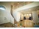 Bright entryway showcasing the staircase, tile floors, and a view to the upper floor at 19886 W Woodlands Ave, Buckeye, AZ 85326