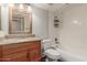 Bathroom featuring a granite countertop vanity and a white tiled shower/tub combination, along with a toilet at 200 E Southern Ave # 226, Tempe, AZ 85282