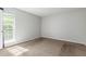 Bright bedroom with carpeted floors, neutral walls, and a large window for natural light at 200 E Southern Ave # 226, Tempe, AZ 85282