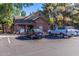 A charming brick building with a well manicured parking lot and mature shade trees at 200 E Southern Ave # 226, Tempe, AZ 85282