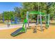 Outdoor exercise area featuring various fitness equipment set on a soft, impact-absorbing surface, surrounded by lush greenery at 200 E Southern Ave # 226, Tempe, AZ 85282