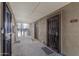 A communal corridor exhibits entry doors, concrete flooring, and a staircase to a higher level at 200 E Southern Ave # 226, Tempe, AZ 85282