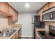 Efficient kitchen features stainless steel appliances, granite countertops, and a tiled backsplash at 200 E Southern Ave # 226, Tempe, AZ 85282