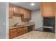 Efficient kitchen featuring granite countertops, stainless steel appliances, and wood cabinets at 200 E Southern Ave # 226, Tempe, AZ 85282