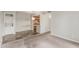 Open-concept living room featuring washer and dryer, kitchen, and carpeted flooring at 200 E Southern Ave # 226, Tempe, AZ 85282
