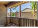 View from the patio, overlooking lush greenery and building, with the community pool visible in the background at 200 E Southern Ave # 226, Tempe, AZ 85282