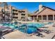 Community pool with lounge chairs at Chesapeake Condominiums, the perfect place for cooling off or relaxing at 200 E Southern Ave # 226, Tempe, AZ 85282