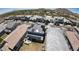Stunning aerial view of a neighborhood featuring houses with solar panels and desert landscaping, set against a backdrop of mountains at 21134 W Minnezona Ave, Buckeye, AZ 85396