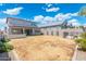 A large backyard with an outdoor living space with a covered patio at 21134 W Minnezona Ave, Buckeye, AZ 85396