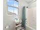 Well-lit bathroom with a bathtub, shower, and vanity, providing a clean and functional space at 21134 W Minnezona Ave, Buckeye, AZ 85396