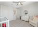 Bright Bedroom featuring neutral walls, white furniture, and plush carpeting for a comfortable space at 21134 W Minnezona Ave, Buckeye, AZ 85396