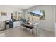 Bright dining room features lots of natural light, dining table with chairs, and built-in storage space at 21134 W Minnezona Ave, Buckeye, AZ 85396