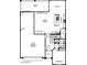 Detailed floor plan showcasing the layout of the first floor with kitchen, garage, living area, and bedroom at 21134 W Minnezona Ave, Buckeye, AZ 85396