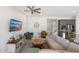 Inviting living room showcasing stylish furnishings and a large entertainment center with a flat-screen TV at 21134 W Minnezona Ave, Buckeye, AZ 85396