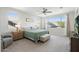 Bright main bedroom features a ceiling fan, large windows, and plush carpet, offering a relaxing retreat at 21134 W Minnezona Ave, Buckeye, AZ 85396