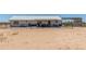 Backyard shot showcasing a white home with a fenced yard at 22578 E Sahara Dr, Florence, AZ 85132