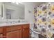 Updated bathroom featuring vanity with marble top and flower shower curtain at 22578 E Sahara Dr, Florence, AZ 85132