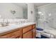 Bathroom with a marble countertop vanity and a glass-enclosed shower at 22578 E Sahara Dr, Florence, AZ 85132