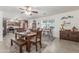 Open-concept dining area adjacent to the kitchen, featuring a wooden table and seating at 22578 E Sahara Dr, Florence, AZ 85132