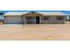 Charming single-story home with metal roof, desert landscaping, and inviting front porch at 22578 E Sahara Dr, Florence, AZ 85132