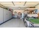 Organized garage with ample storage cabinets and space for a golf cart, perfect for hobbyists or car enthusiasts at 22578 E Sahara Dr, Florence, AZ 85132