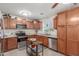 Well-equipped kitchen featuring wooden cabinets, stainless steel appliances, and ample counter space at 22578 E Sahara Dr, Florence, AZ 85132