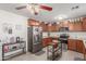 Well-lit kitchen with stainless steel appliances, ample cabinet space, and functional island at 22578 E Sahara Dr, Florence, AZ 85132