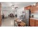 Bright kitchen features stainless steel appliances, stylish countertops, and ample cabinet space, seamlessly flowing into the dining area at 22578 E Sahara Dr, Florence, AZ 85132