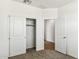 Cozy bedroom with closet and doorway to another room at 25478 W Graham Trl, Buckeye, AZ 85326