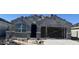 Exterior image of a home under construction, showing the stucco and tile roof at 25478 W Graham Trl, Buckeye, AZ 85326