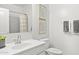 Modern bathroom featuring white vanity, neutral walls, and decorative artwork at 25481 W Graham Trl, Buckeye, AZ 85326