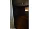Dark bedroom featuring boarded window, ceiling fan, and dark walls at 3308 W Missouri Ave, Phoenix, AZ 85017