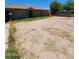 Exterior shot of property featuring gravel yard, covered front porch and flat roof at 3308 W Missouri Ave, Phoenix, AZ 85017
