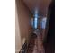 Hallway featuring tile floors and peeling paint at 3308 W Missouri Ave, Phoenix, AZ 85017