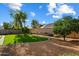 Expansive backyard boasting low-maintenance landscaping with artificial grass and gravel at 3350 E Rosemonte Dr, Phoenix, AZ 85050