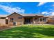 Beautiful backyard featuring artificial turf, patio, and desert landscaping at 3350 E Rosemonte Dr, Phoenix, AZ 85050