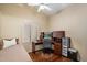 Bedroom with desk, chair, and a daybed, perfect for sleeping or studying at 3350 E Rosemonte Dr, Phoenix, AZ 85050
