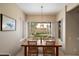 Cozy dining area features a backyard view, perfect for enjoying meals with Gathering and friends at 3350 E Rosemonte Dr, Phoenix, AZ 85050