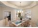 Inviting dining room with a glass top table and seating for eight at 3350 E Rosemonte Dr, Phoenix, AZ 85050