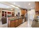 Open kitchen featuring stainless steel appliances and a breakfast bar at 3350 E Rosemonte Dr, Phoenix, AZ 85050