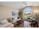 Bright living room with a large window, hardwood floors, and neutral decor at 3350 E Rosemonte Dr, Phoenix, AZ 85050
