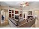 Comfortable living room featuring a large sectional and built-in shelving at 3350 E Rosemonte Dr, Phoenix, AZ 85050
