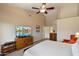 Large main bedroom with a ceiling fan and an ensuite bathroom at 3350 E Rosemonte Dr, Phoenix, AZ 85050