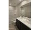 Well-lit bathroom featuring a double sink vanity, large mirror, and a shower-tub combo at 3354 S 180Th Ln, Goodyear, AZ 85338