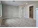 Spacious, naturally lit bedroom featuring plush carpeting, neutral walls, and a closet at 3354 S 180Th Ln, Goodyear, AZ 85338