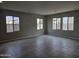 Open-concept living room with large windows and tile flooring at 3354 S 180Th Ln, Goodyear, AZ 85338